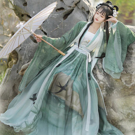 Qiyao Ruqun, Evangeline - Song Dynasty-inspired polyester ensemble with Da Xiu Shan (Coat), camisole, top, and wrapped skirt. An ode to historical opulence, perfect for themed events or adding a touch of sophistication to your wardrobe.