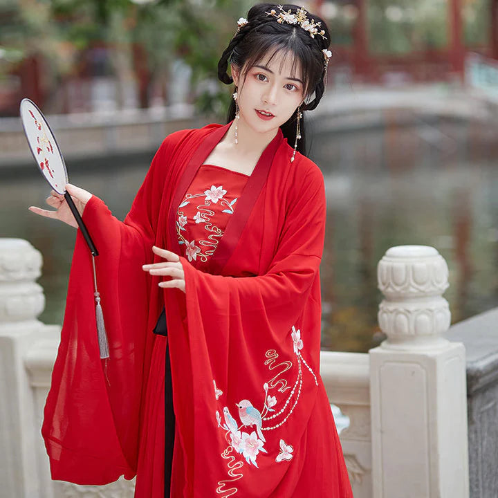 Experience timeless Tang Dynasty-inspired elegance with our Qixiong Ruqun, paying homage to the historical influence of Yang Guifei. This two or three-piece ensemble, complemented by a regal "Da Xiu Shan" coat, seamlessly blends tradition with contemporary style for a sophisticated and graceful look. Step into the allure of the Tang Dynasty with our elegant Salonga attire.