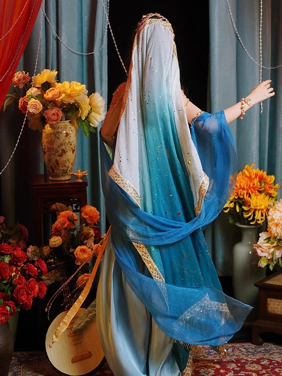 Immerse yourself in the enchanting allure of Fairy Dunhuang Hanfu, a magical fusion of Central Asian, Tibetan, Indian, and Chinese influences exclusively curated by Moon Hanfu. Originating from the northwest Chinese region along the Silk Road, this ethereal attire from our Dunhuang Collection reflects the diverse cultural interactions of the area. Embrace a palette of vibrant colors that weave a story of artistic aesthetics and beliefs, connecting you to a rich tapestry of history.