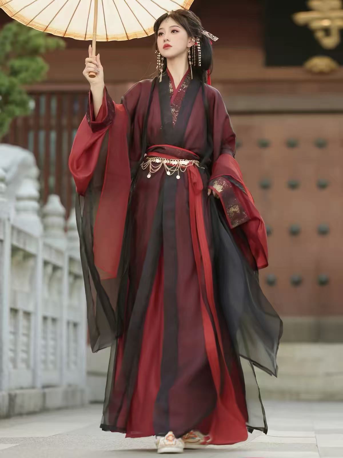 Yu Ji Tan burgundy and black cross-collar hanfu shown from the front, with flowing sleeves and layered fabric.