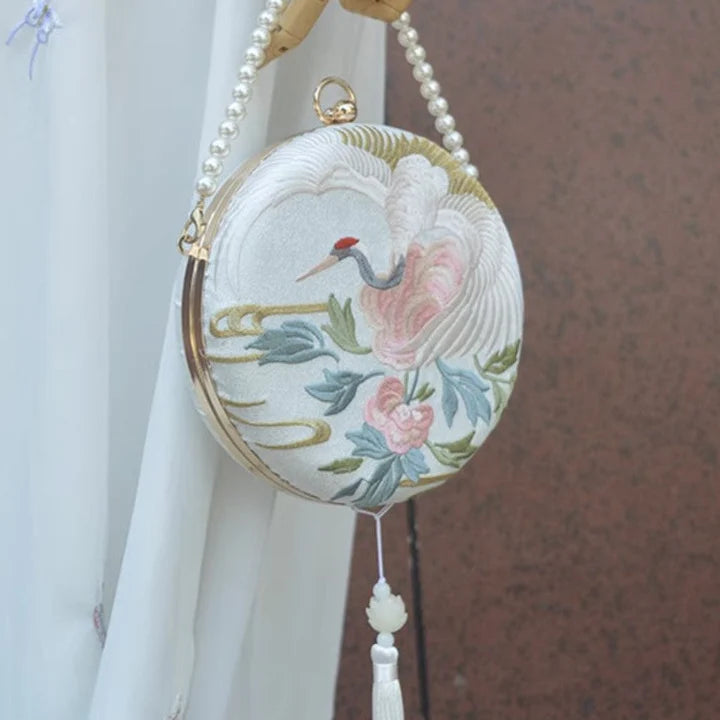 Immerse yourself in the enchantment of the Enchanting Crane Crossbody Bag, inspired by the elements of ancient Chinese Hanfu clothing. Explore our curated collection at Moon Hanfu, where tradition meets modern functionality in these stylish phone bags.