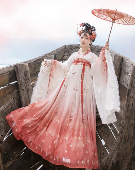 Experience the allure of the Qixiong Ruqun in the Charming Sakura ensemble. This captivating attire seamlessly blends tradition with a touch of contemporary charm. Immerse yourself in the graceful beauty of this outfit, embodying a charming and timeless style inspired by the delicate blossoms of Sakura, adding a touch of floral elegance to your wardrobe.