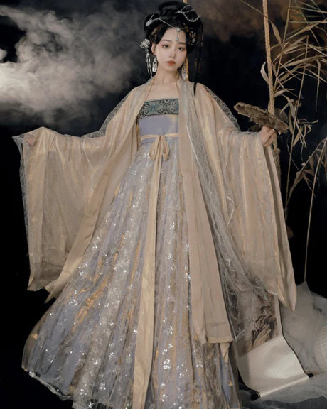 Immerse yourself in enchanting elegance with our Hezi Qun ensemble, Mystical Mina. Experience the magical fusion of tradition and contemporary allure, as you step into a world of mystical beauty and cultural refinement.