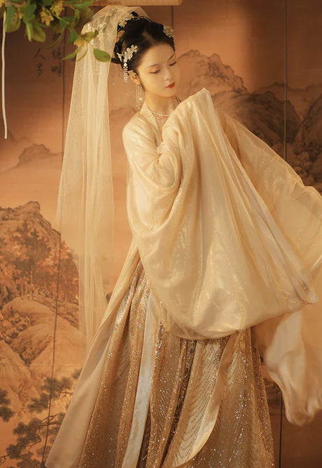 Indulge in the grandeur of our Hezi Qun ensemble, Colossal Ivory. Experience the magnificent fusion of tradition and contemporary style, as you step into a world of colossal beauty and cultural sophistication.