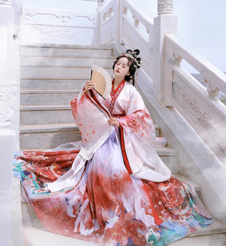 Step into elegance with Maria Jiaoling Ruqun, a captivating tribute to the grace of the Wei Jin Dynasty. Immerse yourself in the distinctive style of cross-collared and wide-sleeved garments, inspired by the iconic Jin Ru 晋襦 and Za Ju 杂裾 fashion trends. Elevate your connection to the rich traditions of Chinese fashion with Moon Hanfu&