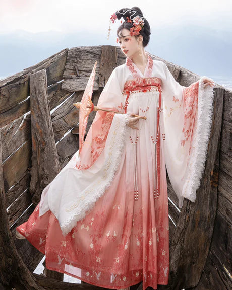 Experience the allure of the Qixiong Ruqun in the Charming Sakura ensemble. This captivating attire seamlessly blends tradition with a touch of contemporary charm. Immerse yourself in the graceful beauty of this outfit, embodying a charming and timeless style inspired by the delicate blossoms of Sakura, adding a touch of floral elegance to your wardrobe.