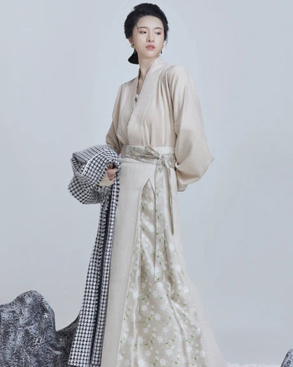 Grace Modern Hanfu Ensemble - Timeless Elegance Revived. Embark on a journey of elegance with Paige, a modern interpretation of traditional beauty. Our Modern Hanfu collection invites you to embrace the allure of the past with a contemporary touch, creating a harmonious blend of sophistication and tradition.