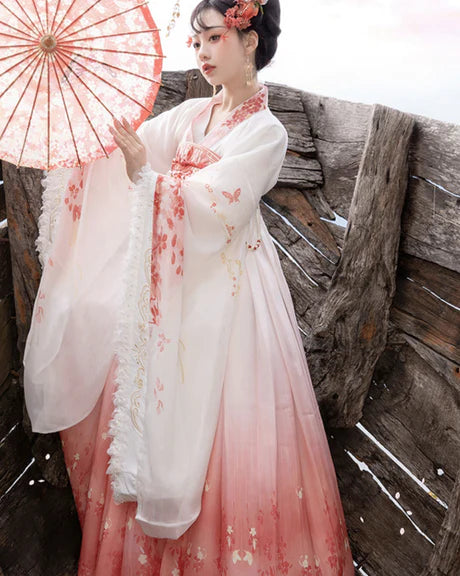 Experience the allure of the Qixiong Ruqun in the Charming Sakura ensemble. This captivating attire seamlessly blends tradition with a touch of contemporary charm. Immerse yourself in the graceful beauty of this outfit, embodying a charming and timeless style inspired by the delicate blossoms of Sakura, adding a touch of floral elegance to your wardrobe.