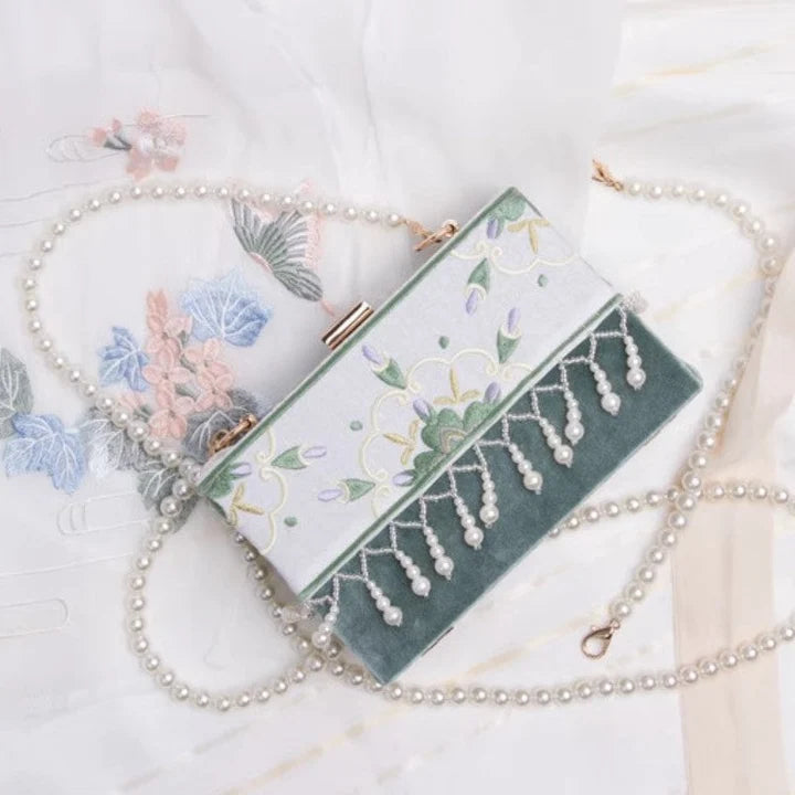 Elevate your style with the Petal Perfection Floral Clutch. Explore our curated collection at Moon Accessories for a fashionable and versatile accessory adorned with delightful floral patterns, adding a touch of natural beauty to your ensemble.