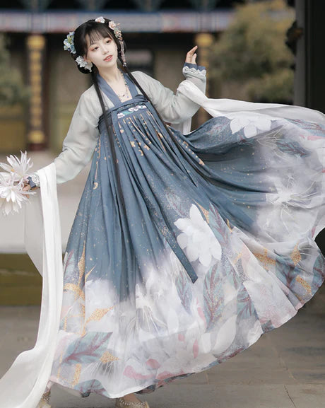 Experience the timeless elegance of our Tang Dynasty-inspired Qixiong Ruqun ensemble, Angelic Ash. Step into history with this regal attire, capturing the allure of the past while embracing contemporary grace.