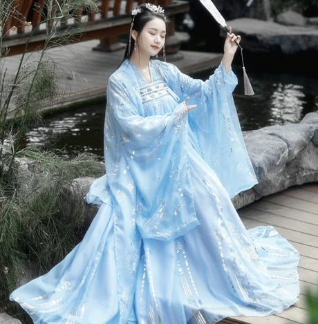 Step into the elegance of Tang Dynasty with Vivacious Blaire, a two or three-piece ensemble inspired by the Qixiong Ruqun. Embrace the regal &quot;Da Xiu Shan&quot; coat, capturing the historical trend with a blend of tradition and contemporary elegance. Experience timeless influence as you step out in style, paying homage to centuries past.