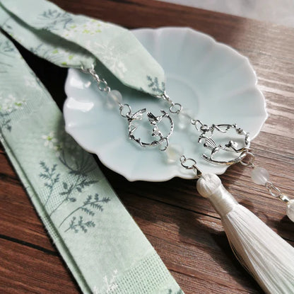 Immerse yourself in enchanting beauty with the Enchanting Paradise Hanfu Hair Tie from Moon Hanfu&