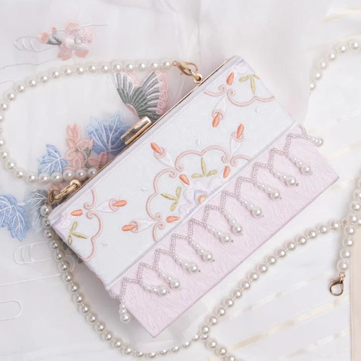 Elevate your style with the Petal Perfection Floral Clutch. Explore our curated collection at Moon Accessories for a fashionable and versatile accessory adorned with delightful floral patterns, adding a touch of natural beauty to your ensemble.