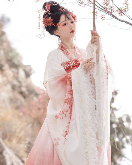 Experience the allure of the Qixiong Ruqun in the Charming Sakura ensemble. This captivating attire seamlessly blends tradition with a touch of contemporary charm. Immerse yourself in the graceful beauty of this outfit, embodying a charming and timeless style inspired by the delicate blossoms of Sakura, adding a touch of floral elegance to your wardrobe.