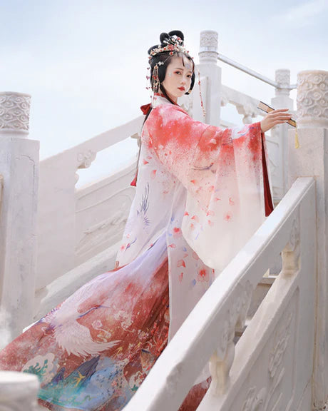 Step into elegance with Maria Jiaoling Ruqun, a captivating tribute to the grace of the Wei Jin Dynasty. Immerse yourself in the distinctive style of cross-collared and wide-sleeved garments, inspired by the iconic Jin Ru 晋襦 and Za Ju 杂裾 fashion trends. Elevate your connection to the rich traditions of Chinese fashion with Moon Hanfu&