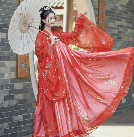 Step into the elegance of Tang Dynasty with Vivacious Blaire, a two or three-piece ensemble inspired by the Qixiong Ruqun. Embrace the regal &quot;Da Xiu Shan&quot; coat, capturing the historical trend with a blend of tradition and contemporary elegance. Experience timeless influence as you step out in style, paying homage to centuries past.