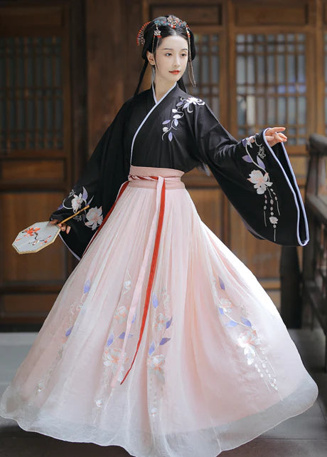 Adorn yourself with the Gorgeous Elegance of Jiaoling Ruqun, a captivating blend of tradition and contemporary allure inspired by the Wei Jin Dynasty. Immerse yourself in the distinctive style of cross-collared and wide-sleeved garments, echoing the iconic Jin Ru 晋襦 and Za Ju 杂裾 fashion trends. Explore and express your unique style with the enchanting Gorgeous Elegance, exclusively available in our Wei Jin Dynasty-inspired pieces at Moon Hanfu.