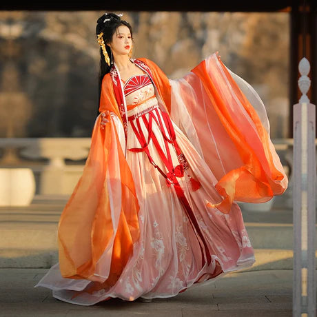 Immerse yourself in the vibrant spirit of the Hezi Qun, beautifully captured in the Cheery Clementine ensemble. This captivating attire seamlessly blends tradition with a touch of contemporary charm. Step into the lively allure of this outfit, embodying a cheery and timeless style that adds a burst of citrus charm to your wardrobe.