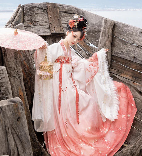 Experience the allure of the Qixiong Ruqun in the Charming Sakura ensemble. This captivating attire seamlessly blends tradition with a touch of contemporary charm. Immerse yourself in the graceful beauty of this outfit, embodying a charming and timeless style inspired by the delicate blossoms of Sakura, adding a touch of floral elegance to your wardrobe.