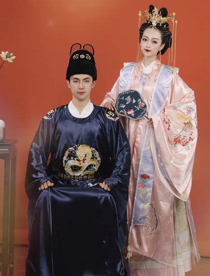 Immerse yourself in the timeless charm of Lunar Dynasty Groom, Ming—an ensemble that echoes the grandeur of the Ming Dynasty. Elevate your wedding day with regal sophistication and celestial allure, making a statement that transcends eras.