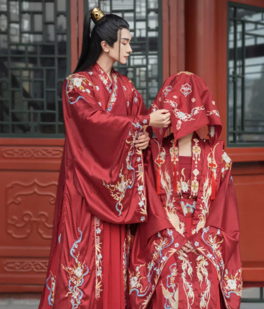 Immerse yourself in the melody of tradition with Serenique Groom, Song—an ensemble that echoes the grace and cultural richness of the Song Dynasty. Elevate your wedding day with a harmonious blend of sophistication and historical allure, making a statement that resonates through time.