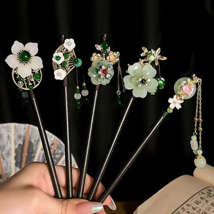 Elevate your style with this versatile Chinese Hairpin Set. Featuring a collection of beautifully crafted hairpins, this set offers a variety of traditional Chinese designs. From delicate floral patterns to intricate motifs, each hairpin is a unique accessory that adds a touch of elegance to any hairstyle. Embrace the cultural heritage of China with this captivating Chinese Hairpin Set and enhance your look with its timeless charm.