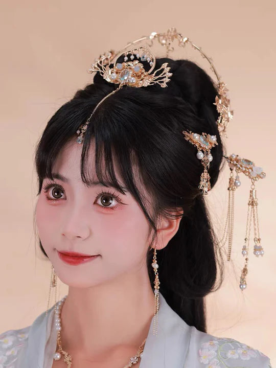 Elevate your style with the charming Delightful Hanfu Hair Accessories collection, designed to add a touch of joy and beauty to your ensemble. From intricately designed hairpins (发簪, fāzān) to stylish hair combs (发篦, fābì), graceful tassels (流苏, liúsū), ornate hair ornaments (发髻, fājì), and versatile hairbands and headpieces (发饰, fāshì), each piece is carefully crafted to enhance your appearance and express your unique style with a delightful flair.