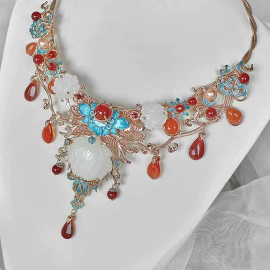 Adorn your Hanfu, Cheongsam, and Bridal Gowns with the graceful charm of Dollette Hanfu Necklace from Moon Hanfu. Immerse yourself in the timeless elegance of this traditional Han Chinese accessory, now transformed into a captivating necklace with intricate details. Explore our curated collection and embrace the cultural richness of traditional Chinese jewelry.