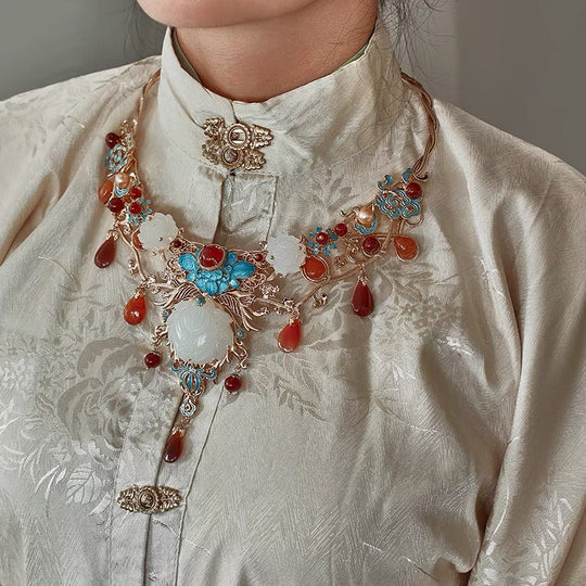 Adorn your Hanfu, Cheongsam, and Bridal Gowns with the graceful charm of Dollette Hanfu Necklace from Moon Hanfu. Immerse yourself in the timeless elegance of this traditional Han Chinese accessory, now transformed into a captivating necklace with intricate details. Explore our curated collection and embrace the cultural richness of traditional Chinese jewelry.