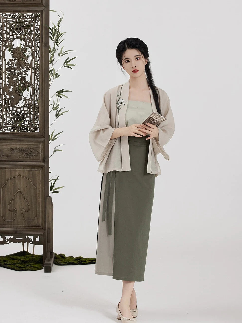 Immerse yourself in the graceful blend of Elegant Bamboo Fusion Modern Hanfu—a harmonious marriage of tradition and contemporary allure. Elevate your wardrobe with this captivating ensemble, embodying the timeless beauty of ancient Chinese fashion. The Elegant Bamboo Fusion Hanfu invites you to rediscover grace and cultural richness, seamlessly blending tradition with a touch of modern sophistication.