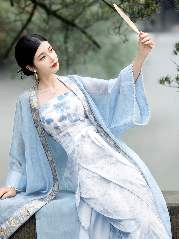 Elevate your style with the Parisian Chic Modern Hanfu Ensemble, a harmonious blend of modern sophistication and timeless beauty. Immerse yourself in the allure of our Modern Hanfu collection, seamlessly capturing the essence of tradition with a contemporary touch. Discover the sophistication and grace of traditional Chinese fashion with the Parisian Chic