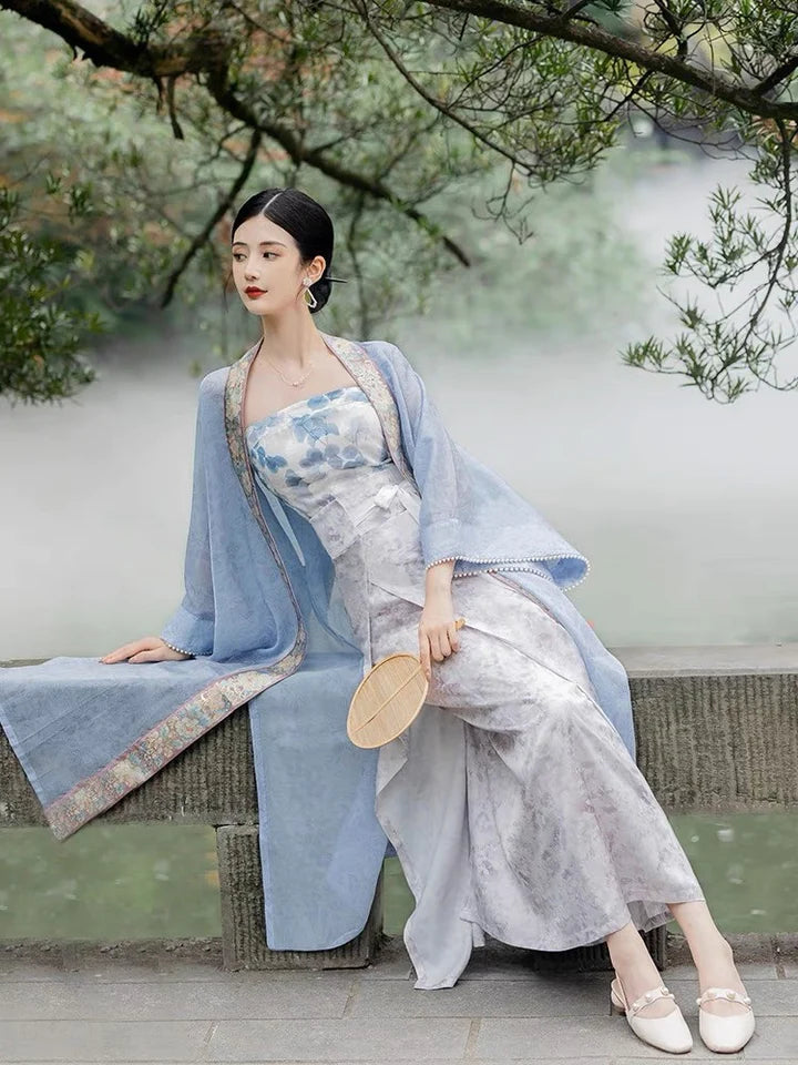 Elevate your style with the Parisian Chic Modern Hanfu Ensemble, a harmonious blend of modern sophistication and timeless beauty. Immerse yourself in the allure of our Modern Hanfu collection, seamlessly capturing the essence of tradition with a contemporary touch. Discover the sophistication and grace of traditional Chinese fashion with the Parisian Chic