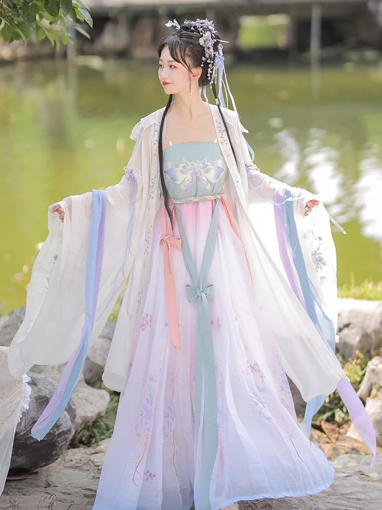 Immerse yourself in the enchantment of the Tang Dynasty with our Enchanting Hezi Qun, Whimsy Lianne—an ensemble paying homage to an era when style mirrored societal shifts. Influenced by Yang Guifei, this Tang Dynasty-inspired Qixiong Ruqun captures historical trends, seamlessly blending tradition with contemporary elegance. Step into the past with timeless influence, making a whimsical statement in style.