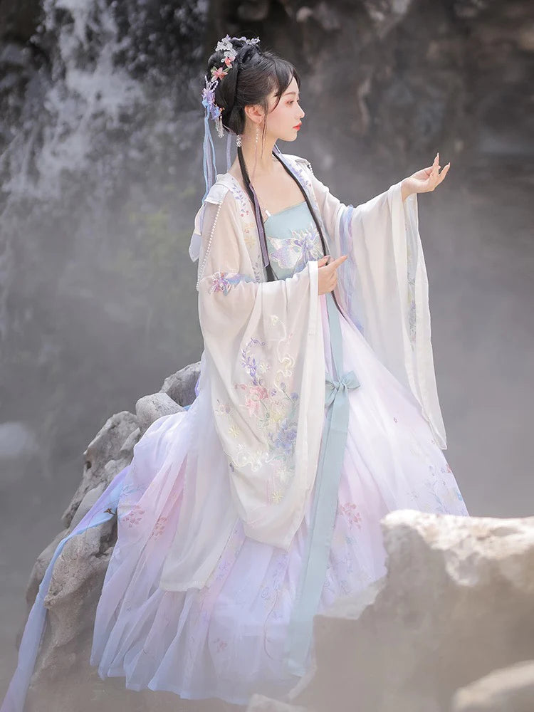 Immerse yourself in the enchantment of the Tang Dynasty with our Enchanting Hezi Qun, Whimsy Lianne—an ensemble paying homage to an era when style mirrored societal shifts. Influenced by Yang Guifei, this Tang Dynasty-inspired Qixiong Ruqun captures historical trends, seamlessly blending tradition with contemporary elegance. Step into the past with timeless influence, making a whimsical statement in style.