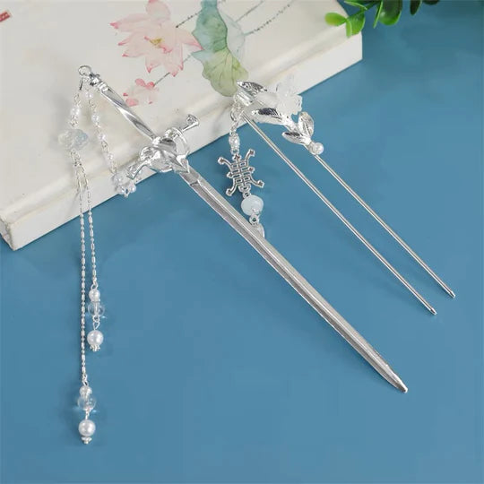 Embrace the spirit of ancient China with the captivating Chinese Sword Hairpin. This unique hairpin features a stylish design inspired by traditional Chinese swords, adding a touch of martial elegance to your hairstyle. Crafted with attention to detail, the Chinese Sword Hairpin is a perfect accessory to showcase your love for Chinese culture and add a distinctive flair to your Hanfu ensemble.