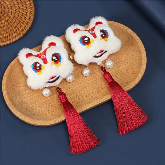 Lion Dance-Inspired Hair Clip - Channel the vibrant energy of the lion dance with this captivating hair clip, featuring intricate designs inspired by the traditional Chinese performance.