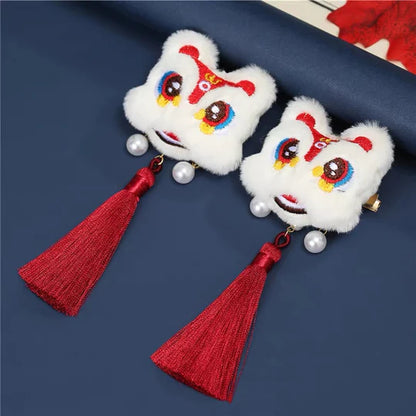 Lion Dance-Inspired Hair Clip - Channel the vibrant energy of the lion dance with this captivating hair clip, featuring intricate designs inspired by the traditional Chinese performance.