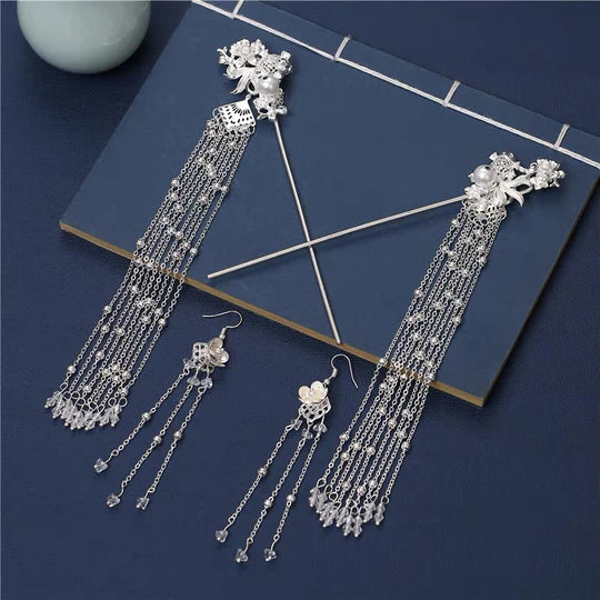 Silvermoon Hanfu Hair Adornments - Elevate your style with the enchanting Silvermoon Hanfu Hair Accessories collection, designed to add a touch of elegance and shine to your ensemble. From intricately designed hairpins (发簪, fāzān) to stylish hair combs (发篦, fābì), graceful tassels (流苏, liúsū), ornate hair ornaments (发髻, fājì), and versatile hairbands and headpieces (发饰, fāshì), each piece is meticulously crafted to enhance your appearance and express your unique style with a touch of silver allure.