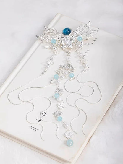 Elevate your style with the exquisite Gemstone Hanfu Hair Accessories collection, designed to add a touch of luxury and brilliance to your ensemble. From intricately designed hairpins (发簪, fāzān) to stylish hair combs (发篦, fābì), graceful tassels (流苏, liúsū), ornate hair ornaments (发髻, fājì), and versatile hairbands and headpieces (发饰, fāshì), each piece features stunning gemstones that enhance your appearance and express your unique style with the captivating allure of precious gems.