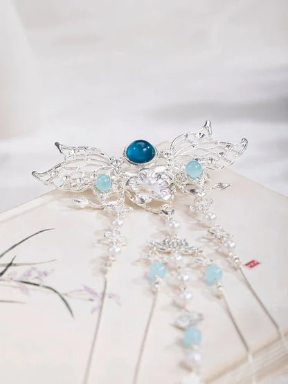 Elevate your style with the exquisite Gemstone Hanfu Hair Accessories collection, designed to add a touch of luxury and brilliance to your ensemble. From intricately designed hairpins (发簪, fāzān) to stylish hair combs (发篦, fābì), graceful tassels (流苏, liúsū), ornate hair ornaments (发髻, fājì), and versatile hairbands and headpieces (发饰, fāshì), each piece features stunning gemstones that enhance your appearance and express your unique style with the captivating allure of precious gems.