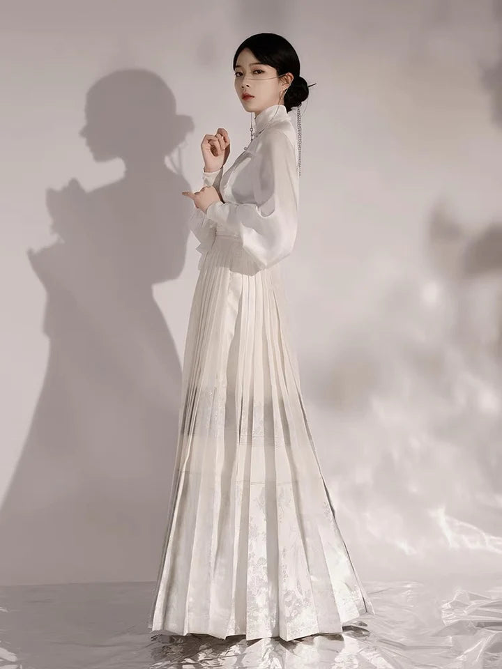 Elevate your style with the Regal Elegance Modern Hanfu Ensemble, a harmonious blend of modern sophistication and timeless beauty. Immerse yourself in the allure of our Modern Hanfu collection, seamlessly capturing the essence of tradition with a contemporary touch. Discover the sophistication and grace of traditional Chinese fashion with the Regal Elegance