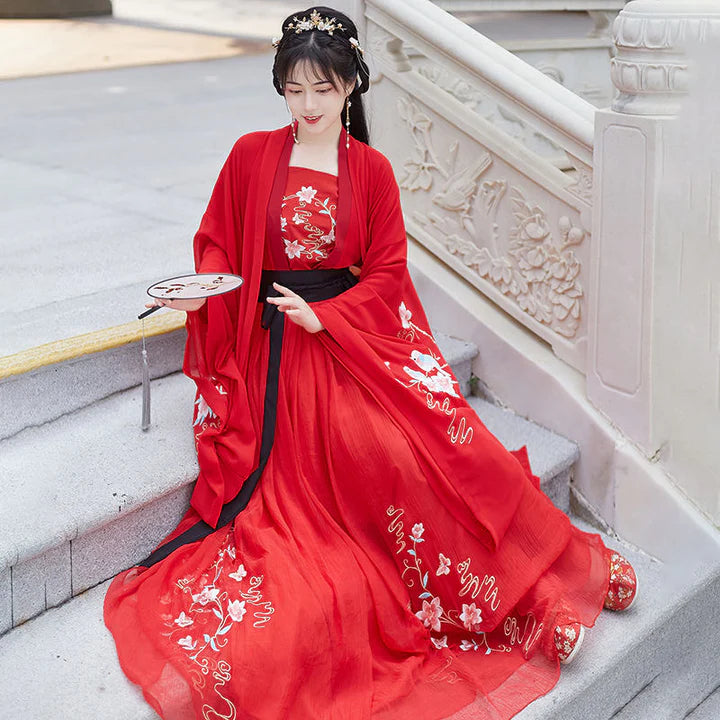 Experience timeless Tang Dynasty-inspired elegance with our Qixiong Ruqun, paying homage to the historical influence of Yang Guifei. This two or three-piece ensemble, complemented by a regal &quot;Da Xiu Shan&quot; coat, seamlessly blends tradition with contemporary style for a sophisticated and graceful look. Step into the allure of the Tang Dynasty with our elegant Salonga attire.