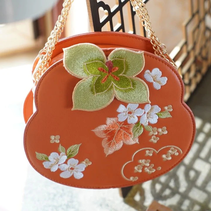 Elevate your style with the Embroidered Persimmon Crossbody Bag, a perfect blend of sophistication and cultural flair. Explore our curated collection at Moon Accessories for a stylish and functional addition to your ensemble.