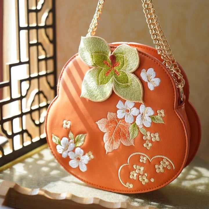 Elevate your style with the Embroidered Persimmon Crossbody Bag, a perfect blend of sophistication and cultural flair. Explore our curated collection at Moon Accessories for a stylish and functional addition to your ensemble.