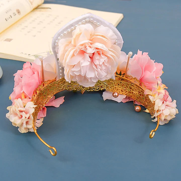 Floura Hanfu Crown - Unleash your inner floral beauty with the Floura Hanfu Crown. Its captivating design and delicate floral motifs add a touch of natural elegance, perfect for weddings, garden parties, or any special occasion. Embrace your inner flower princess with this enchanting crown.