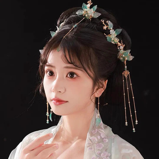 Solena Hanfu Hair Adornments - Elevate your style with the captivating Solena Hanfu Hair Accessories collection, designed to add a touch of allure and sophistication to your ensemble. From intricately designed hairpins (发簪, fāzān) to stylish hair combs (发篦, fābì), graceful tassels (流苏, liúsū), ornate hair ornaments (发髻, fājì), and versatile hairbands and headpieces (发饰, fāshì), each piece is meticulously crafted to enhance your appearance and express your unique style.