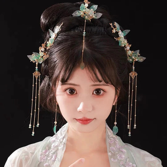 Solena Hanfu Hair Adornments - Elevate your style with the captivating Solena Hanfu Hair Accessories collection, designed to add a touch of allure and sophistication to your ensemble. From intricately designed hairpins (发簪, fāzān) to stylish hair combs (发篦, fābì), graceful tassels (流苏, liúsū), ornate hair ornaments (发髻, fājì), and versatile hairbands and headpieces (发饰, fāshì), each piece is meticulously crafted to enhance your appearance and express your unique style.