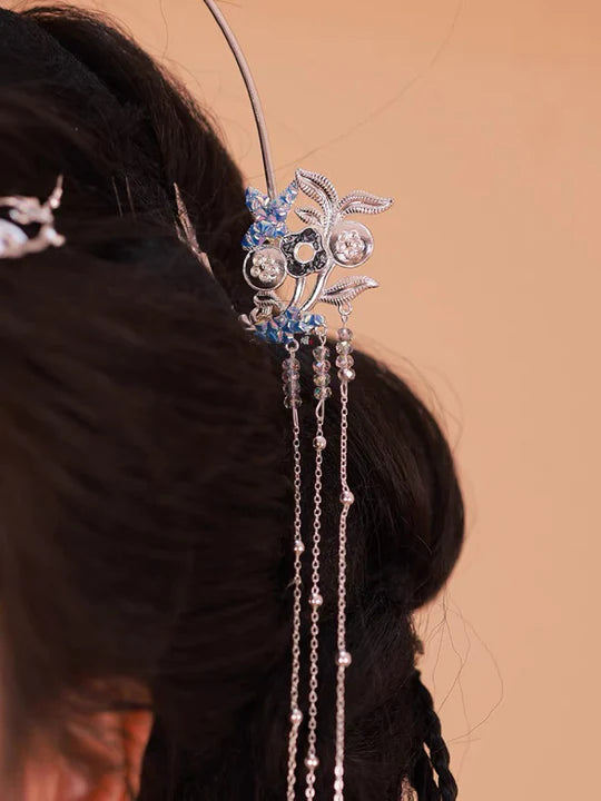 Nia Hanfu Hair Adornments - Elevate your style with the captivating Nia Hanfu Hair Accessories collection, designed to add a touch of allure and individuality to your ensemble. From intricately designed hairpins (发簪, fāzān) to stylish hair combs (发篦, fābì), graceful tassels (流苏, liúsū), ornate hair ornaments (发髻, fājì), and versatile hairbands and headpieces (发饰, fāshì), each piece is meticulously crafted to enhance your appearance and express your unique style with the enchanting charm of Nia.