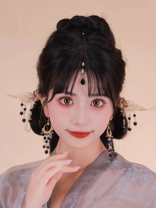 Elevate your style with the enchanting Midnight Hanfu Hair Accessories collection, designed to add a touch of mystery and allure to your ensemble. From intricately designed hairpins (发簪, fāzān) to stylish hair combs (发篦, fābì), graceful tassels (流苏, liúsū), ornate hair ornaments (发髻, fājì), and versatile hairbands and headpieces (发饰, fāshì), each piece is meticulously crafted to enhance your appearance and express your unique style with the captivating charm of a midnight sky.