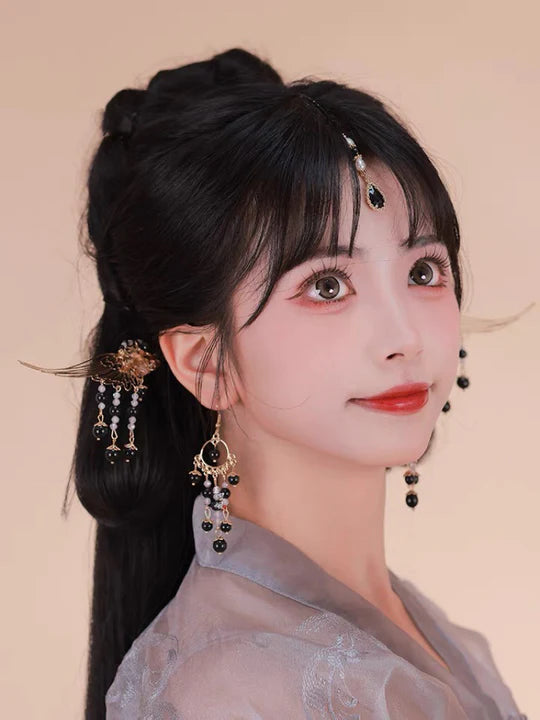 Elevate your style with the enchanting Midnight Hanfu Hair Accessories collection, designed to add a touch of mystery and allure to your ensemble. From intricately designed hairpins (发簪, fāzān) to stylish hair combs (发篦, fābì), graceful tassels (流苏, liúsū), ornate hair ornaments (发髻, fājì), and versatile hairbands and headpieces (发饰, fāshì), each piece is meticulously crafted to enhance your appearance and express your unique style with the captivating charm of a midnight sky.